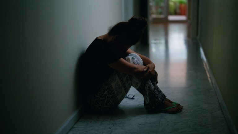 Photo of a person exhibiting the hidden signs of high-functioning depression.